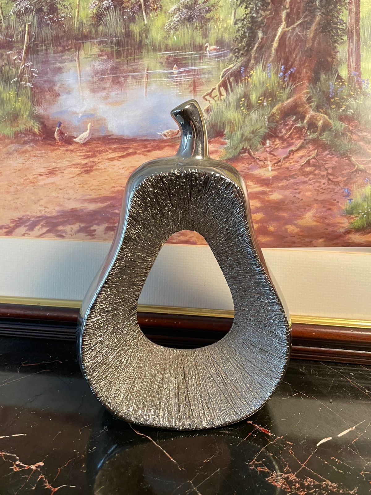 silver ceramic decor, pear shaped vase, modern centerpiece ornament, metallic home decor, ceramic pear decorative piece, silver fruit sculpture, elegant tabletop decoration, unique home accents, modern living room decor, artistic pear statue