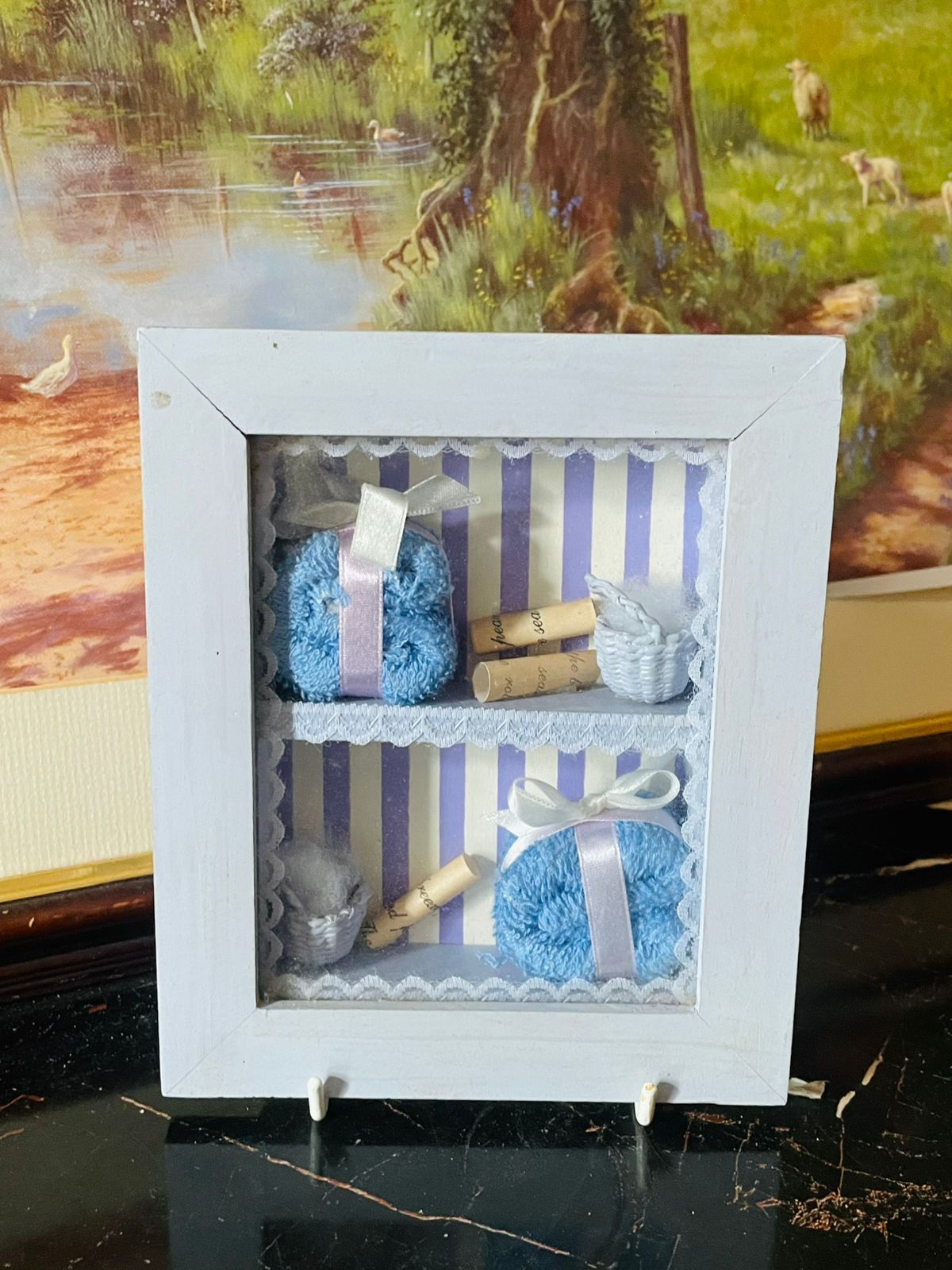 mini wall frame decor, miniature towel shadow box, blue ribbon frame, vintage home decor, thrift home finds, european vintage wall art, rare thrift collection pakistan, cottagecore wall decor, handmade mini frame, england wall decor, shadow box vintage england, sunset kitchen vintage shop, collectible miniature wall art, small decor frame pakistan