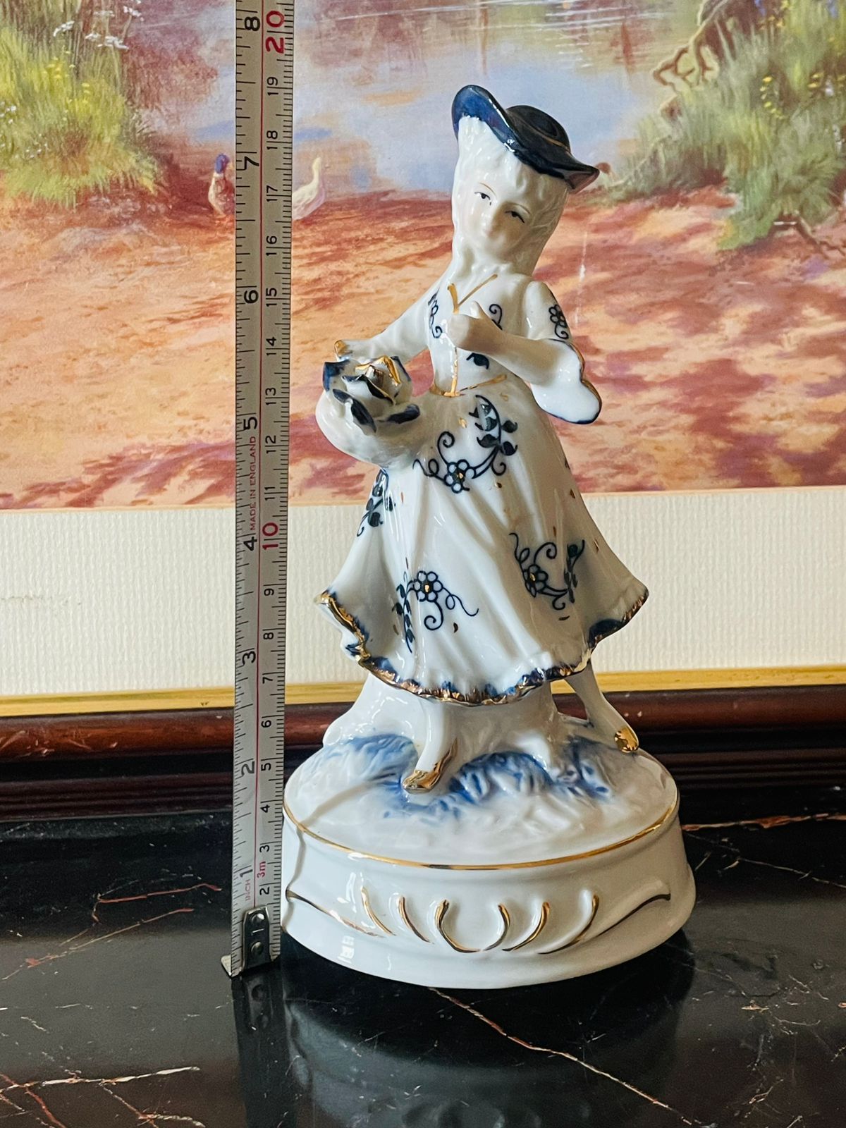 Musical Vintage Porcelain Girl Figurine with Hat & Basket – Blue Floral Dress (Music Box Base) Blue pottery