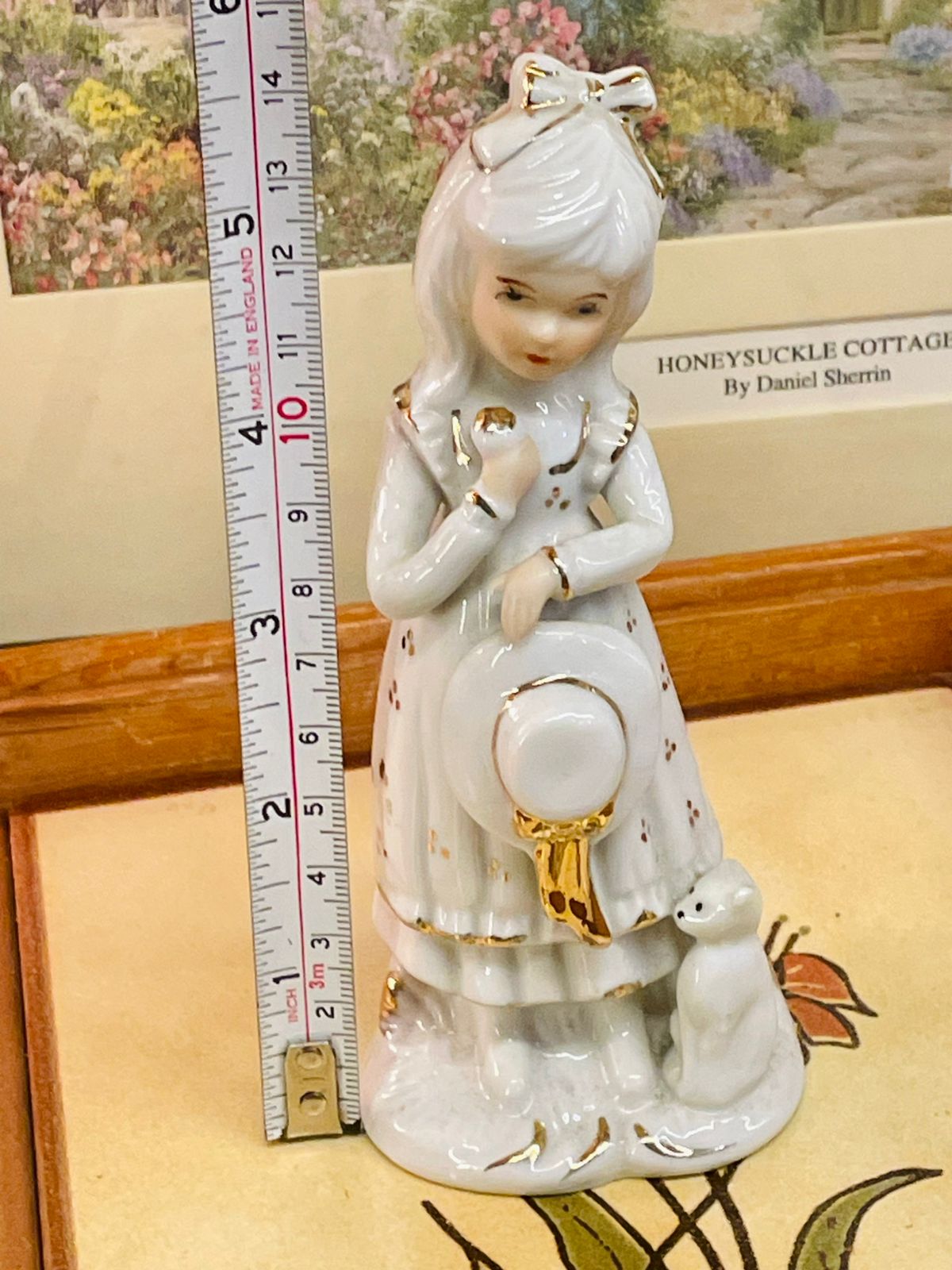 White & Gold Ceramic Girl Figurine with Puppy – Elegant Home Décor