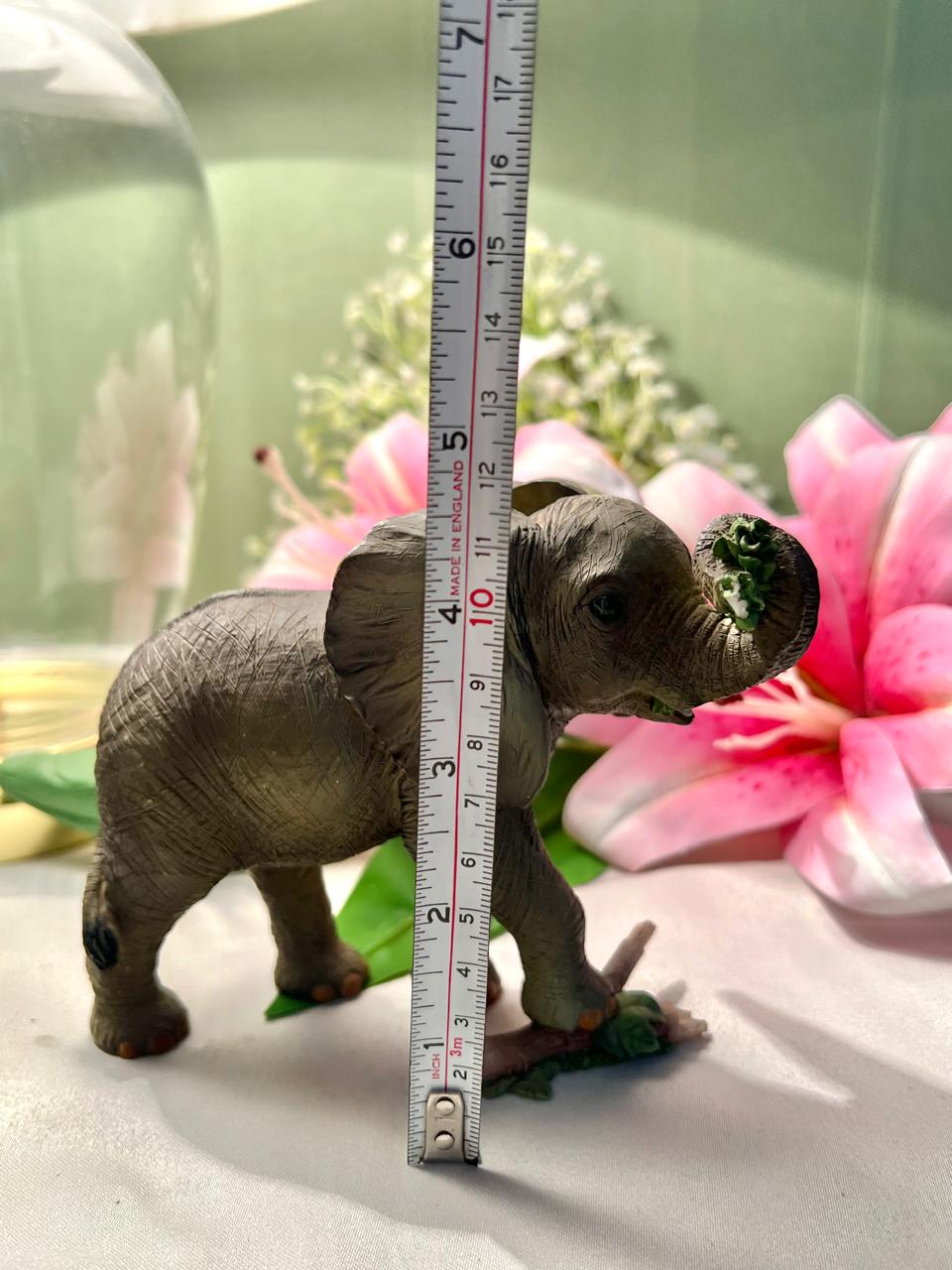 Elephant Figurine with Raised Trunk & Floral Detail – 12 cm
