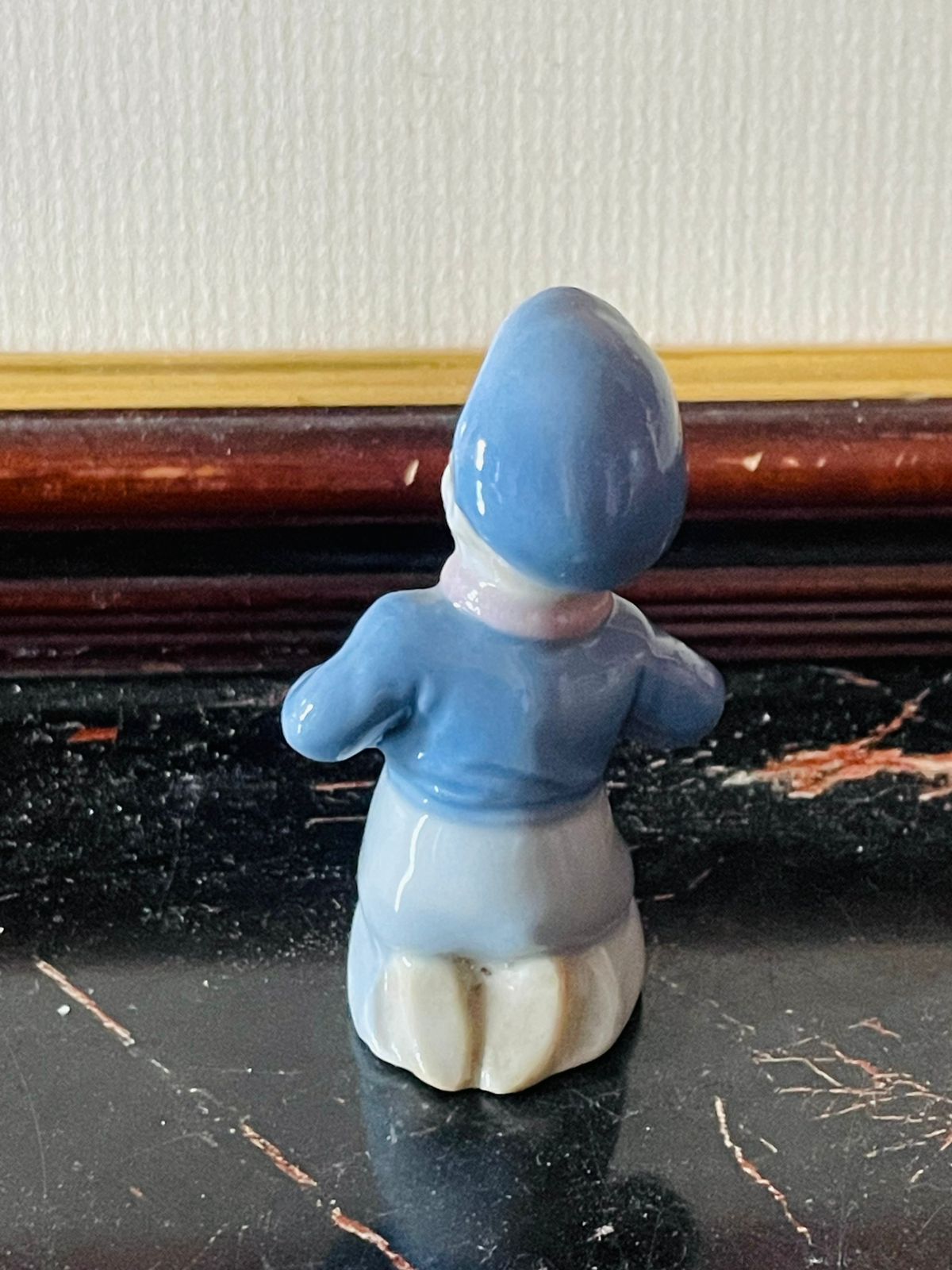 Vintage Porcelain Boy Figurine – Kneeling Child in Blue Attire (England)Blue pottery