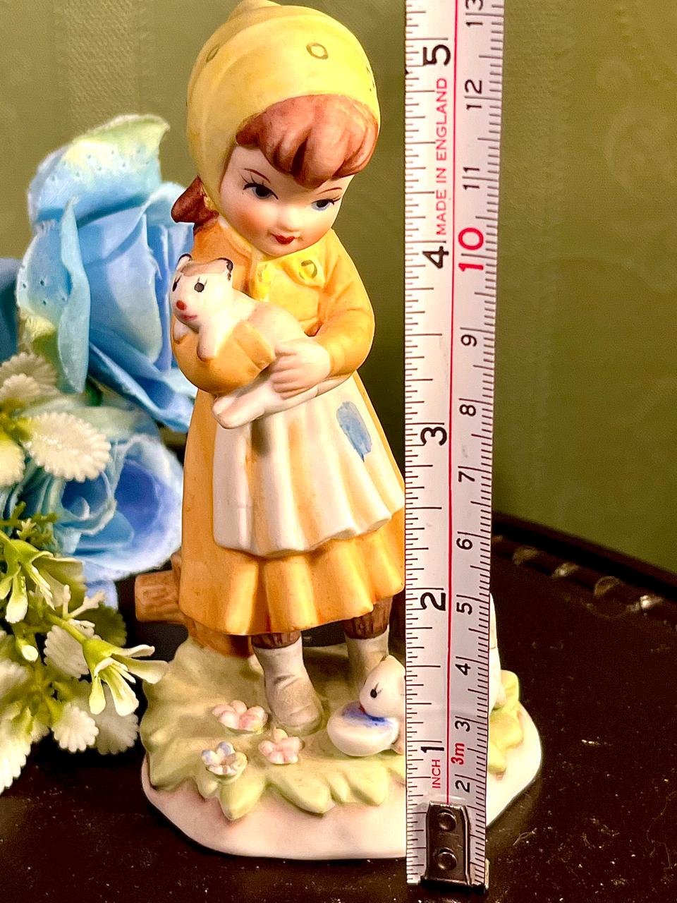 Girl Holding White Puppy Figurine Yellow Hood 4.5 Inch