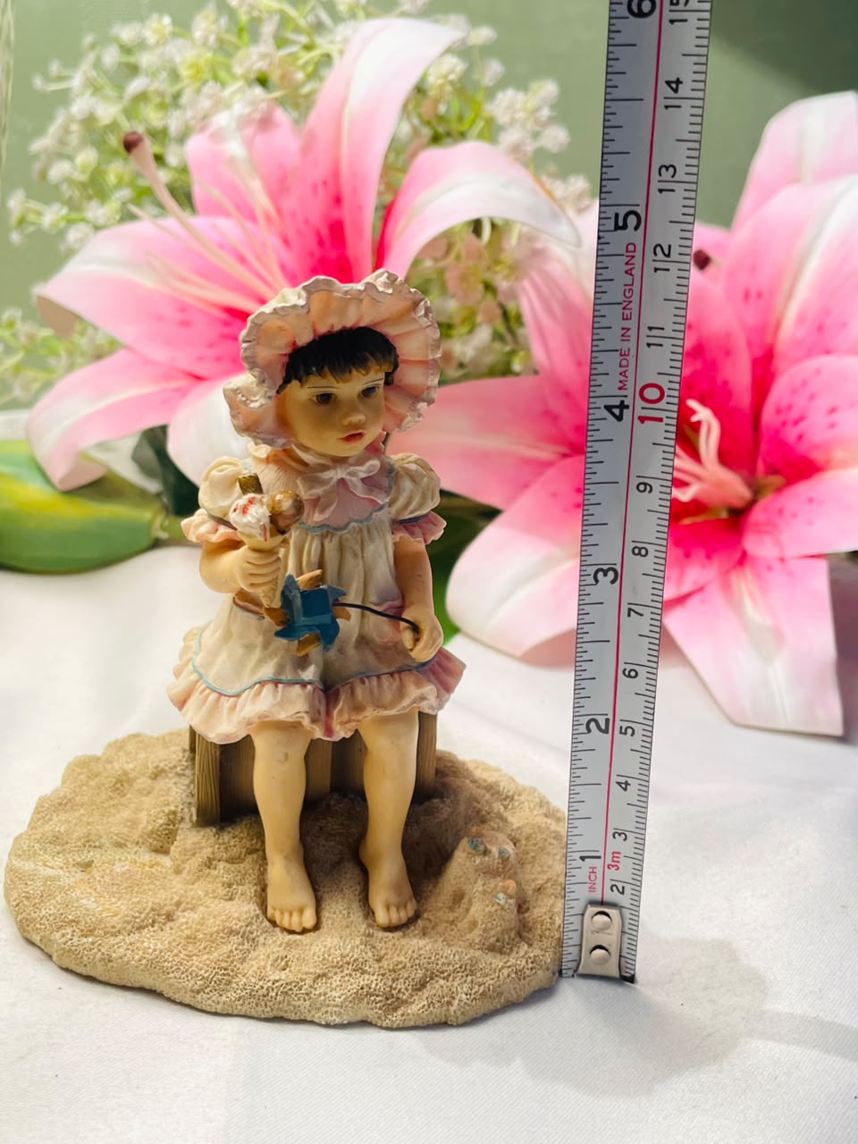 Vintage Style Seated Girl Figurine with Bonnet 10 cm