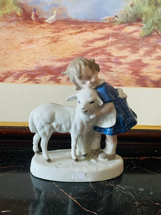 vintage porcelain figurine, girl with lamb figurine, england porcelain decor, hand painted collectible, countryside ceramic statue, vintage home decor pakistan, rare thrift finds, english porcelain figurine, girl hugging sheep ornament, fine glazed porcelain england, european collectible decor, sunset kitchen vintage shop, cottagecore shelf decor, vintage ceramic statue england
