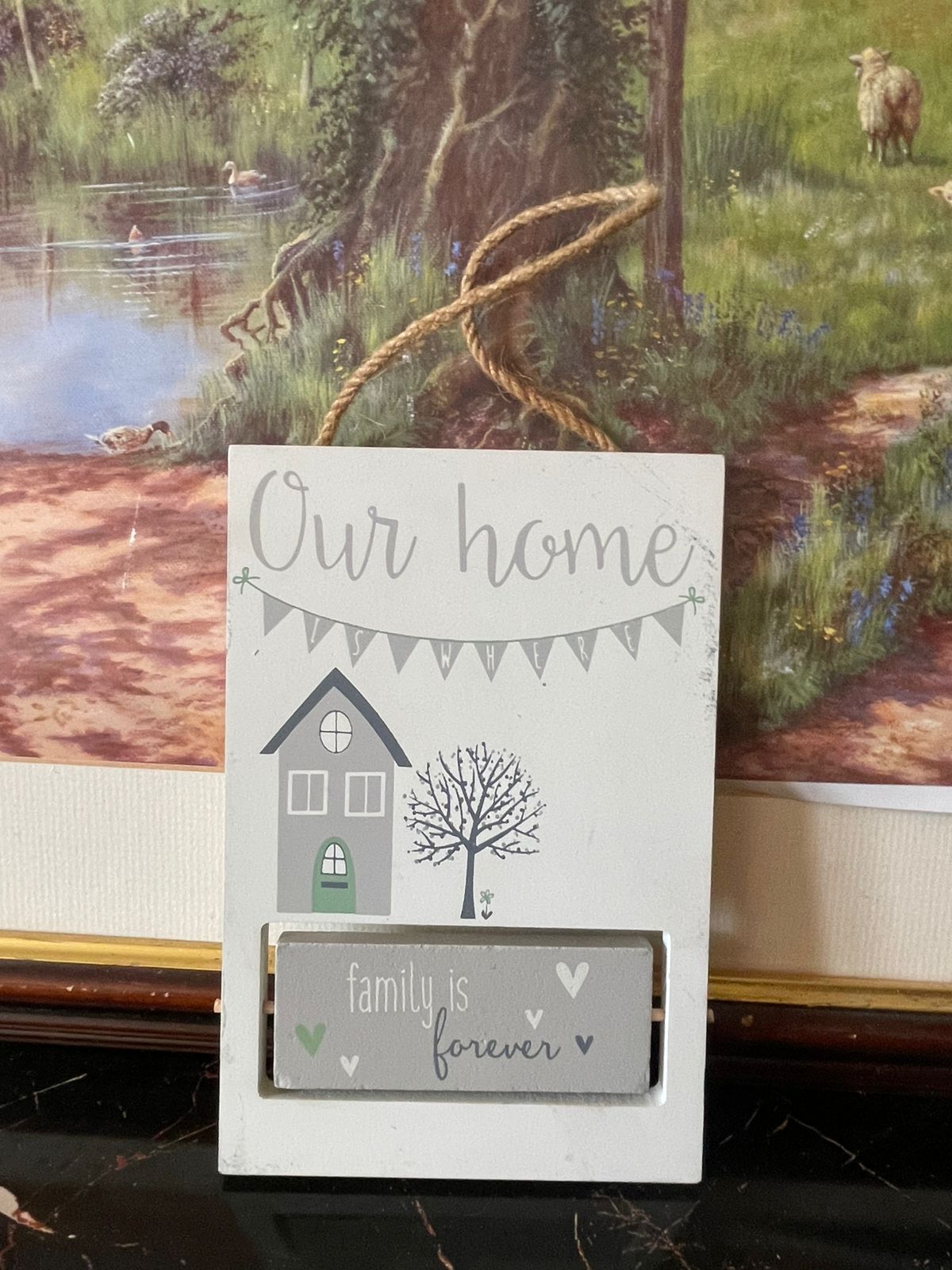 white ceramic wall plaque, family is forever hanging décor, rustic jute rope wall sign, our home ceramic plaque England, vintage home décor Pakistan, sentimental wall hanging gift, farmhouse style ceramic wall art, rare thrift finds Pakistan, family quote wall plaque, timeless vintage home accent