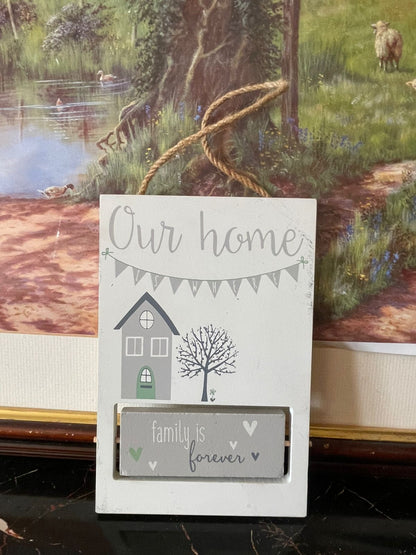 white ceramic wall plaque, family is forever hanging décor, rustic jute rope wall sign, our home ceramic plaque England, vintage home décor Pakistan, sentimental wall hanging gift, farmhouse style ceramic wall art, rare thrift finds Pakistan, family quote wall plaque, timeless vintage home accent