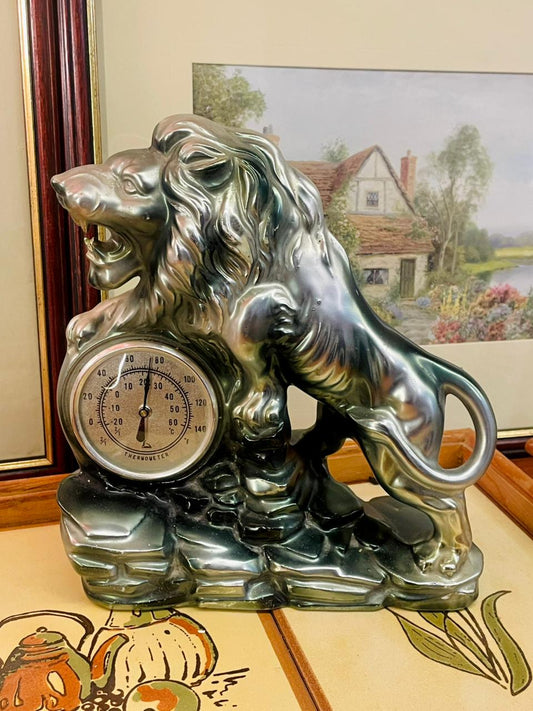 lion statue decor, vintage thermometer decor, roaring lion sculpture, metallic ceramic figurine, office desk decor, collectible animal figurine, regal home decor, vintage pottery ornament, unique decorative statue, shelf display art
