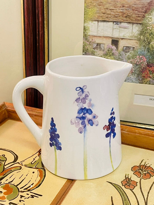 decorative pitcher, ceramic jug, floral jug, cottagecore decor, farmhouse kitchen display, white ceramic vase, flower pitcher, shelf decor, home accents, vintage style decor, jug vase