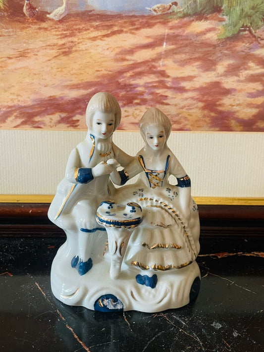 vintage couple figurine, porcelain collectible England, blue and white decor, antique lovers figurine, classical European collectible, vintage home decor, porcelain art, rare thrift find Pakistan, romantic vintage statue, elegant porcelain couple, heritage European decor, Sunset Kitchen vintage collection