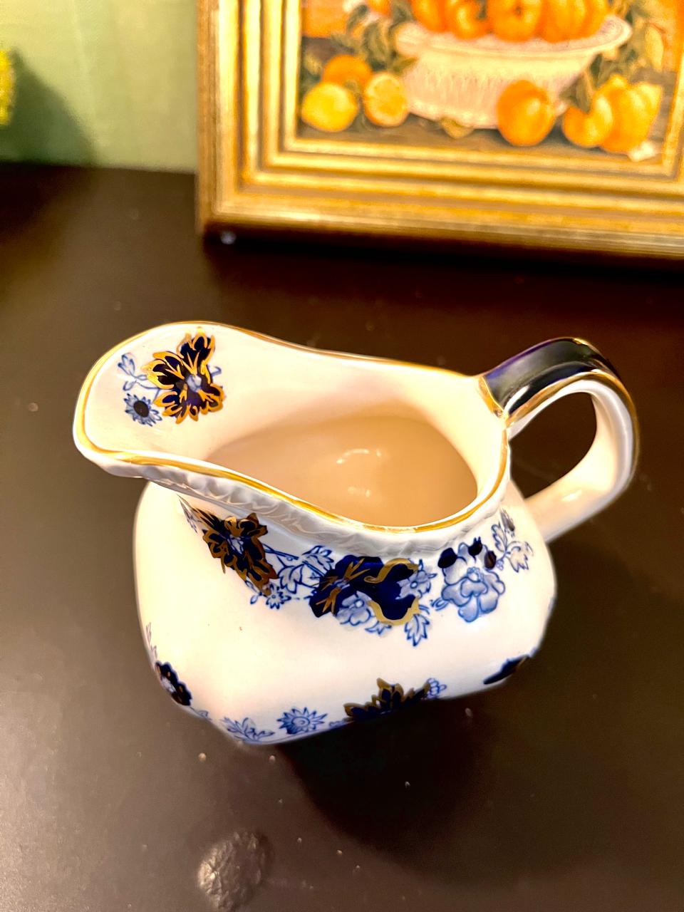 Vintage Blue Floral Porcelain Pitcher with Gold Trim – 5 Inch