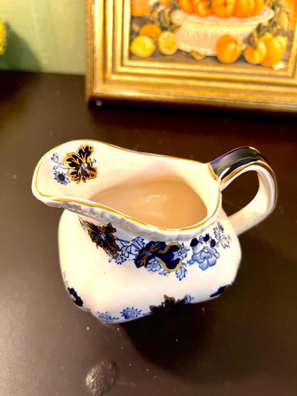 Vintage Blue Floral Porcelain Pitcher with Gold Trim – 5 Inch