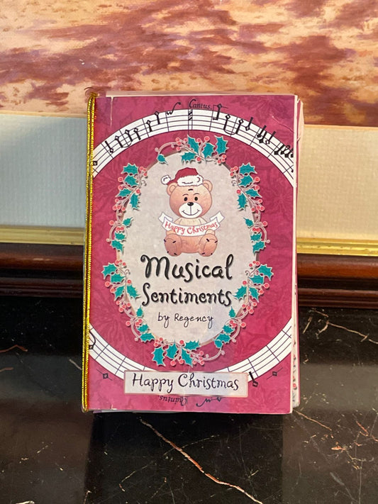 Christmas music box, Christmas bear decoration, Regency musical sentiments, holiday collectible gifts, Merry Christmas décor, festive music toy, Christmas gift ideas Pakistan, holiday bear figurine, musical Christmas gift, vintage Christmas collectible