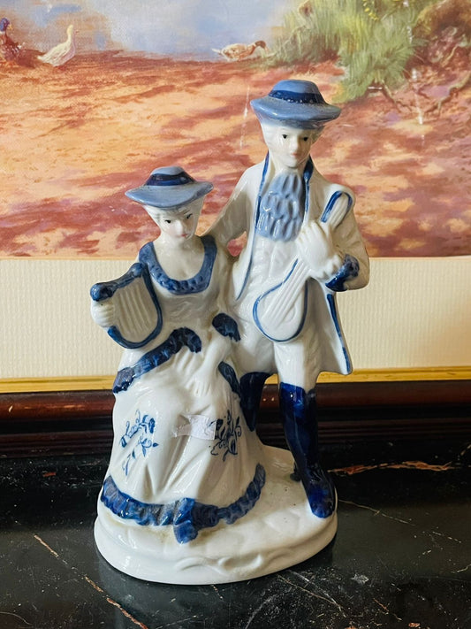 victorian porcelain figurine, couple with musical instruments, blue and white porcelain decor, english collectible figurines, european vintage art, antique home accents, cobalt blue porcelain england, romantic vintage decor, rare thrift finds, sunset kitchen vintage collection