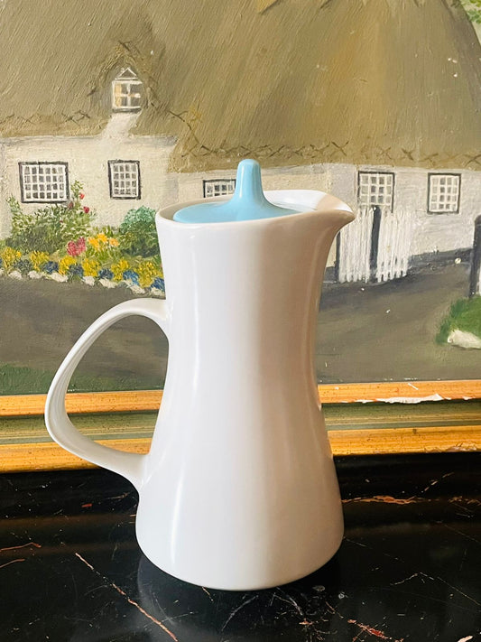 mid century modern coffee pot, vintage english teapot, white ceramic pitcher, minimalist pottery england, retro kitchen decor, sky blue lid coffee pot, mod vintage tableware, scandinavian style crockery, sunset kitchen vintage collection
