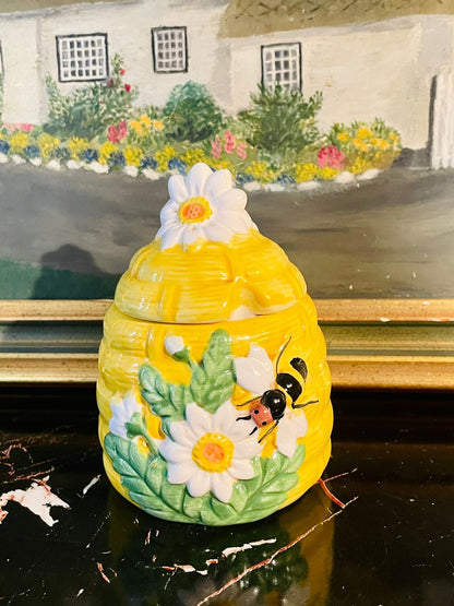 ceramic honey pot, beehive honey jar, bee design kitchenware, ceramic honey jar with lid, honey storage container, decorative honey pot, bee and flower ceramic pot, ceramic sugar jar, beehive decor jar
