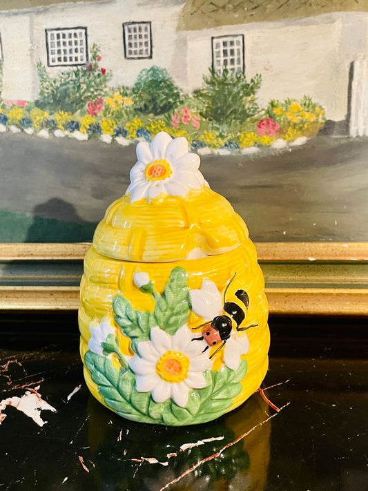 ceramic honey pot, beehive honey jar, bee design kitchenware, ceramic honey jar with lid, honey storage container, decorative honey pot, bee and flower ceramic pot, ceramic sugar jar, beehive decor jar
