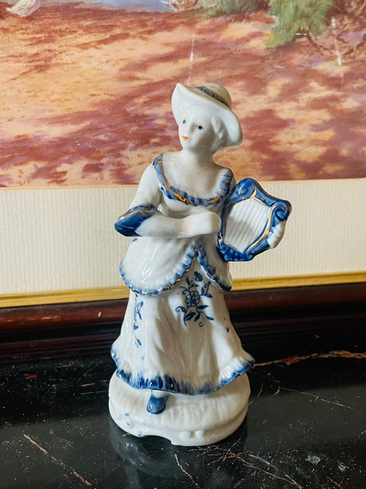 vintage porcelain figurines, blue and white porcelain, couple playing harp, antique European figurines, collectible porcelain England, royal blue vintage decor, romantic porcelain sculpture, fine ceramic collectibles, heritage European decor, thrift home treasures, Sunset Kitchen vintage collection