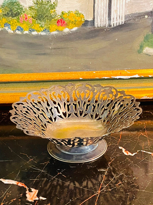 vintage lace bowl, silver plated pedestal dish, pierced metal decor, shabby chic home accessories, cottagecore table styling, antique trinket bowl, ornate silver decor, vintage centerpiece bowl, pedestal fruit dish