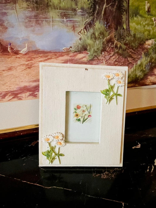 rare thrift finds, vintage floral photo frame, decorative daisy frame, cream textured frame, vintage home décor Pakistan, European vintage drop, curated vintage collection, English decorative frame, antique style frame, timeless vintage décor