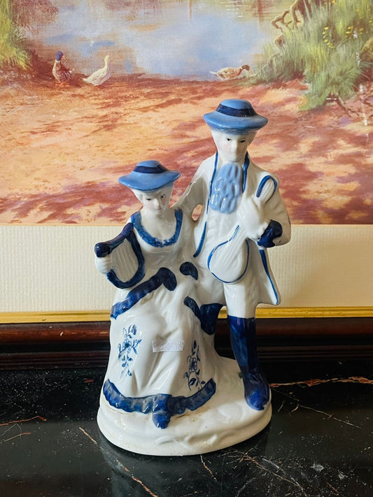 vintage porcelain figurines, blue and white porcelain, colonial couple figurine, musical instrument figurines, antique European decor, royal blue porcelain England, collectible ceramic figurines, European vintage treasures, romantic couple sculpture, rare thrift find, timeless vintage decor, Sunset Kitchen vintage collection