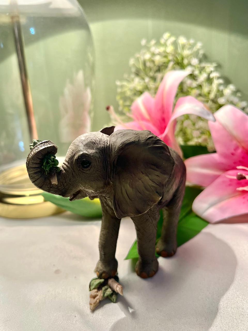 Elephant Figurine with Raised Trunk & Floral Detail – 12 cm