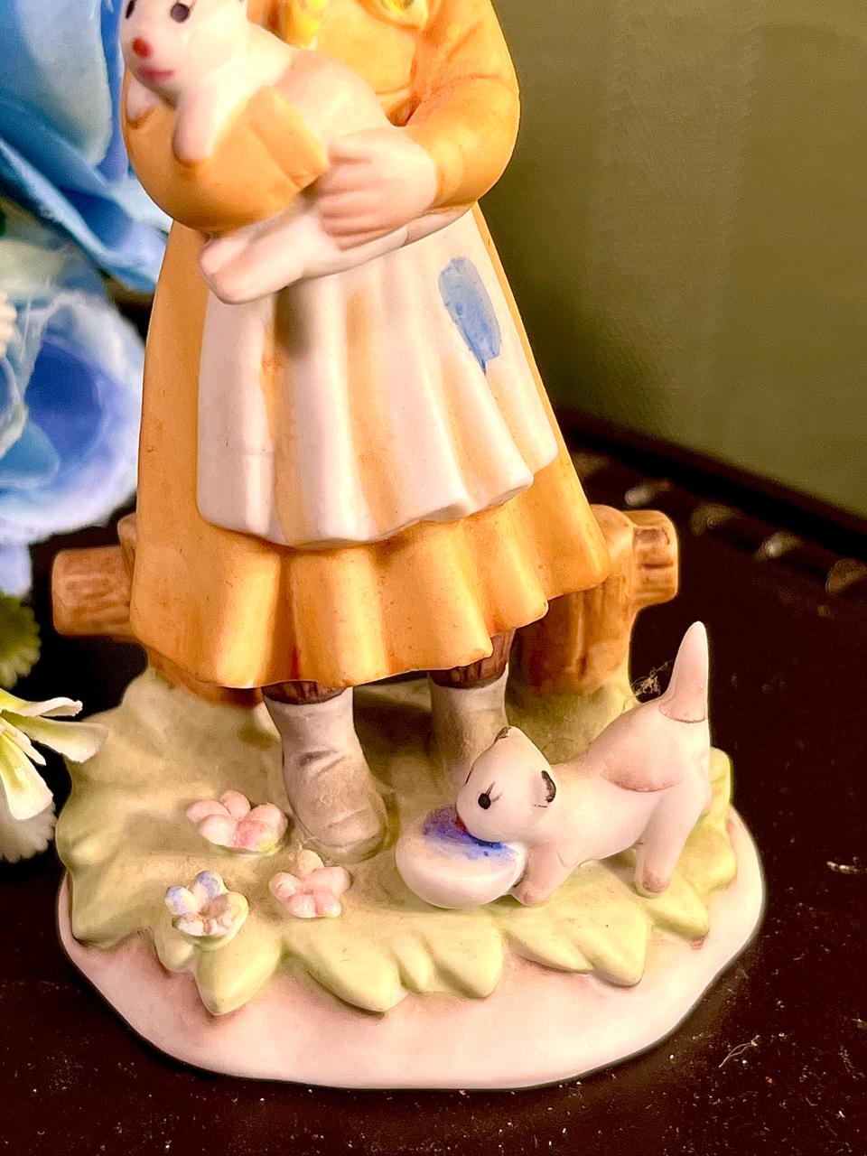 Girl Holding White Puppy Figurine Yellow Hood 4.5 Inch
