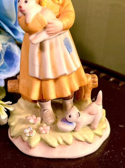 Girl Holding White Puppy Figurine Yellow Hood 4.5 Inch