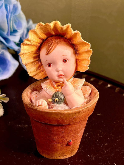 Child in Flowerpot with Bird Figurine 4 Inch