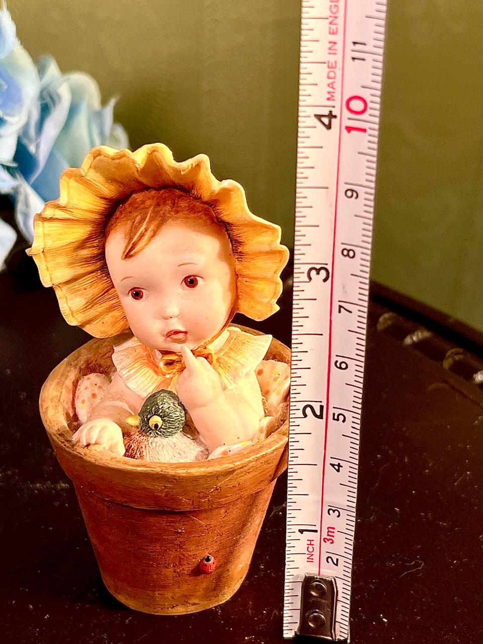 Child in Flowerpot with Bird Figurine 4 Inch