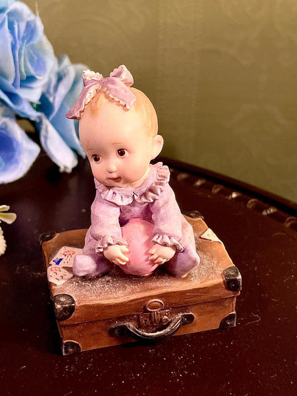 Baby on Suitcase Figurine Lavender Outfit 4 Inch