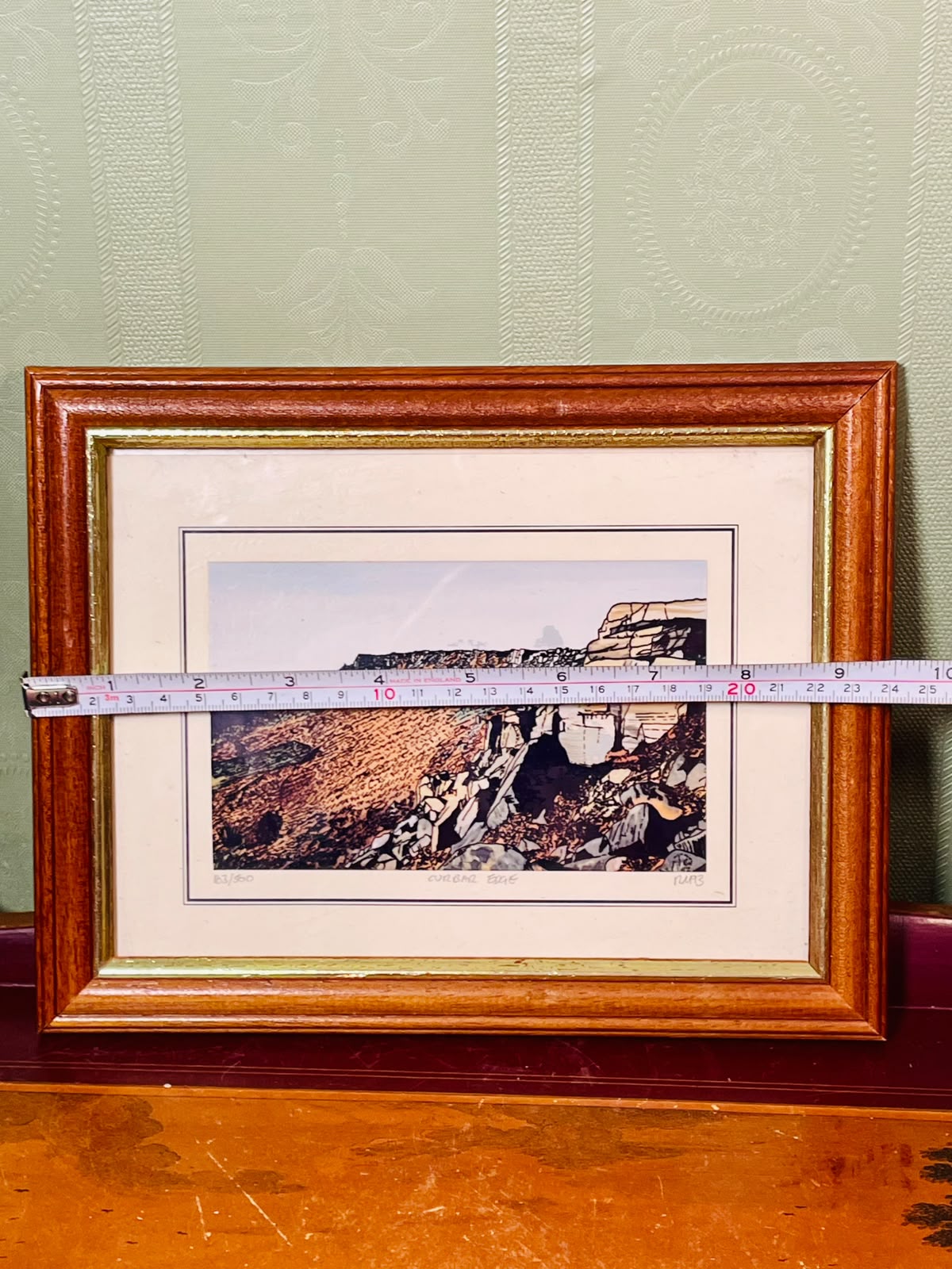 Framed Coastal Cliff Art Painting in Brown Frame Approx. 9.5 inch
