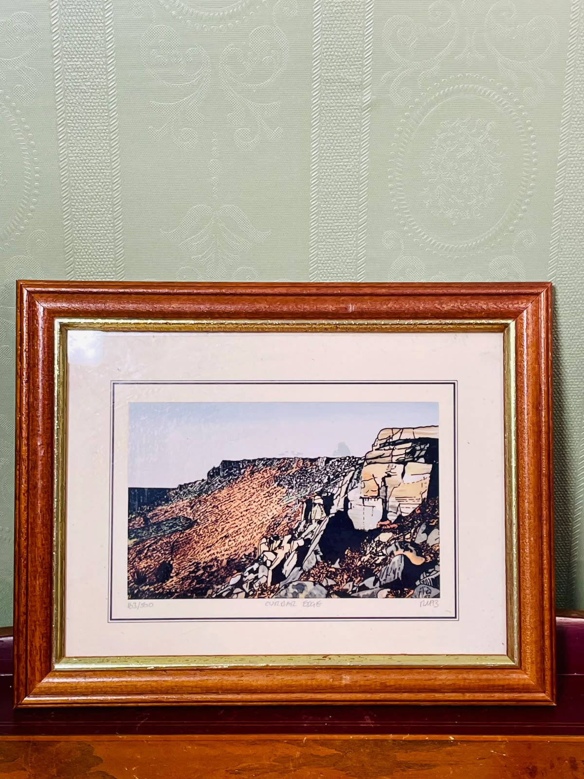 Framed Coastal Cliff Art Painting in Brown Frame Approx. 9.5 inch