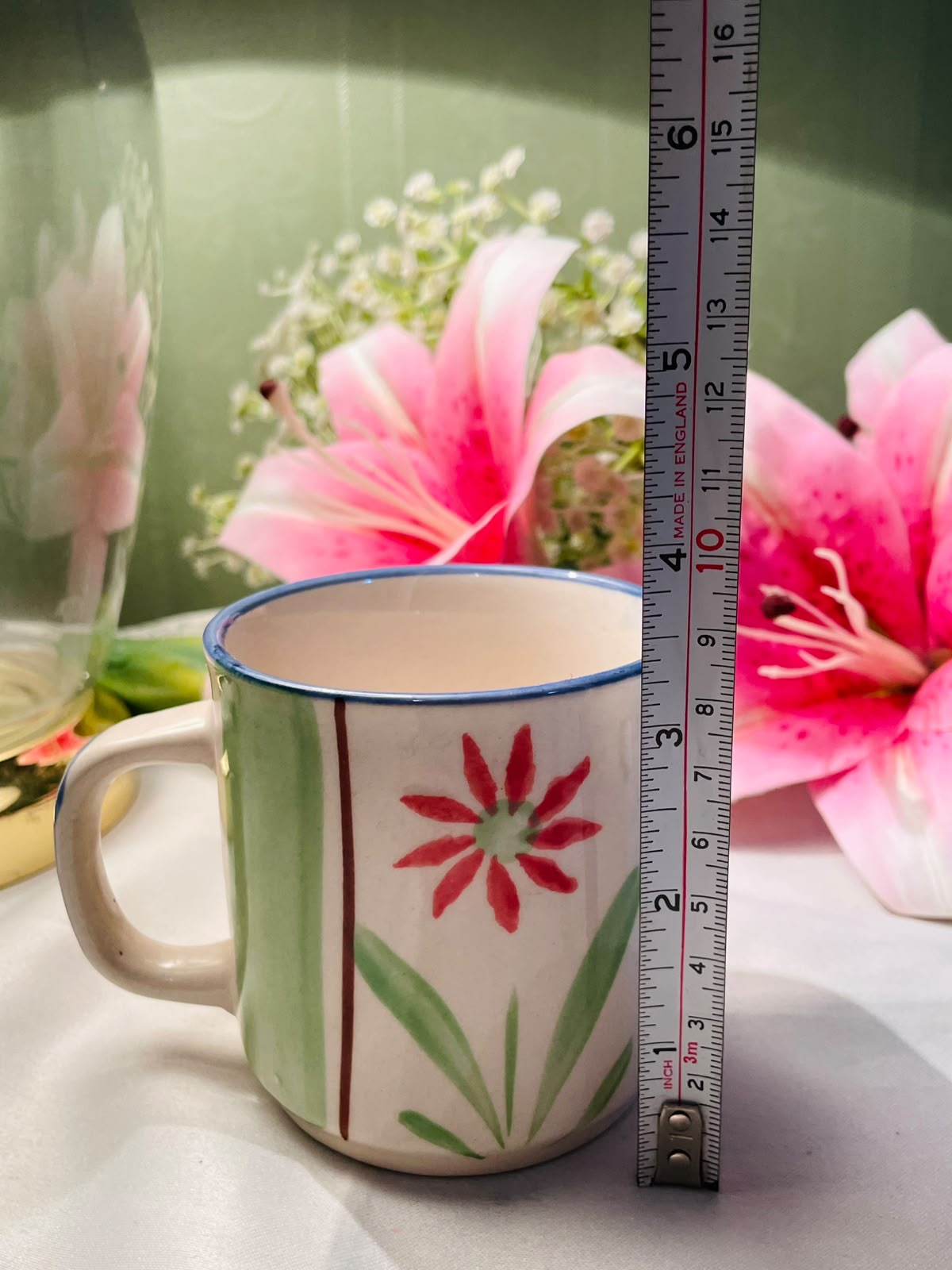 Hand painted Green & Red Floral Ceramic Mug Blue Rim 9 cm