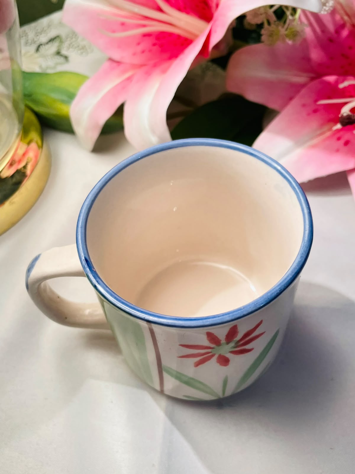 Hand painted Green & Red Floral Ceramic Mug Blue Rim 9 cm