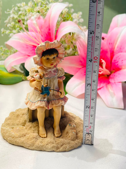Vintage Style Seated Girl Figurine with Bonnet 10 cm