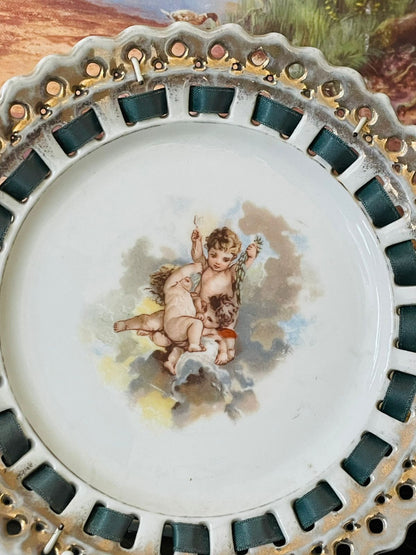 Antique Porcelain Decorative Plate with Cherub Motif – Pierced Edge & Gilded Trim
