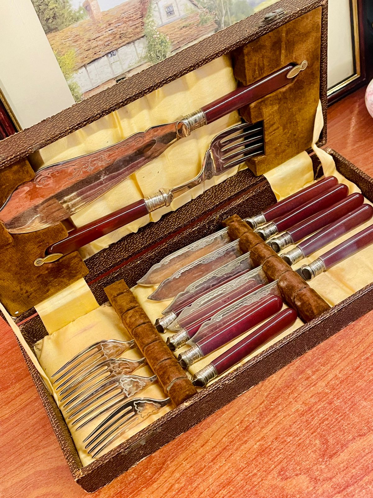 vintage cutlery set, maroon handle cutlery, boxed cutlery set, vintage knives forks, tableware set, retro kitchen decor, antique style cutlery, collectible cutlery, dining set vintage, stainless steel vintage