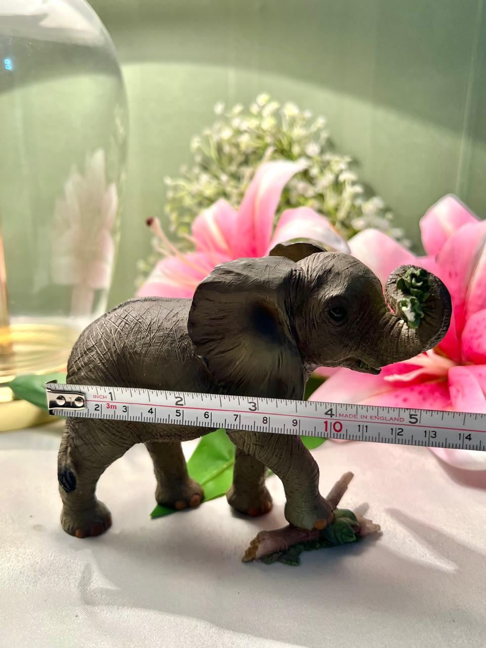 Elephant Figurine with Raised Trunk & Floral Detail – 12 cm