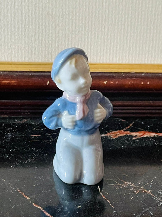 vintage porcelain boy figurine, English porcelain collectible, vintage child figurine, glazed porcelain decor, thrift home decor Pakistan, rare thrift finds, European vintage collection, small vintage figurine England, collectible porcelain boy, classic home decoration