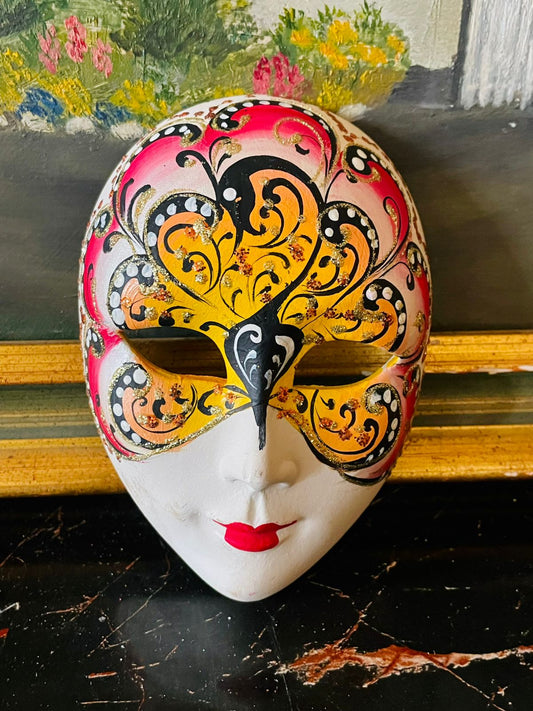 wall mask, venetian mask, carnival mask, masquerade decor, wall hanging face, vintage wall art, home decor Pakistan, red gold decor, Italian style mask, masquerade collectible, boho wall decor, statement art piece, face mask decor