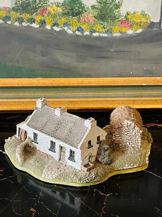 Charming stoneware cottage miniature — perfect for rustic home styling, garden decor, or fairy-house displays.