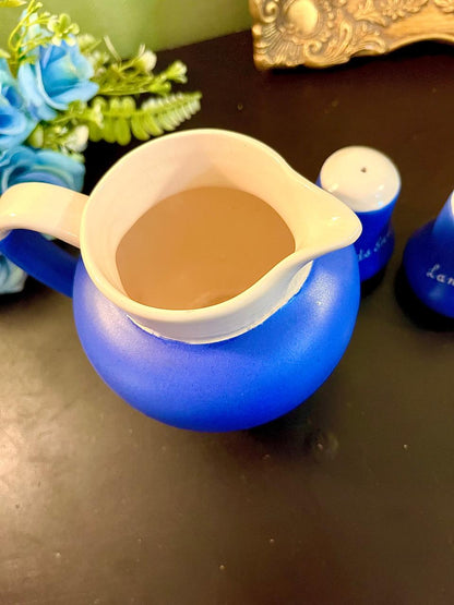 Blue jug and shaker set with gold script lettering