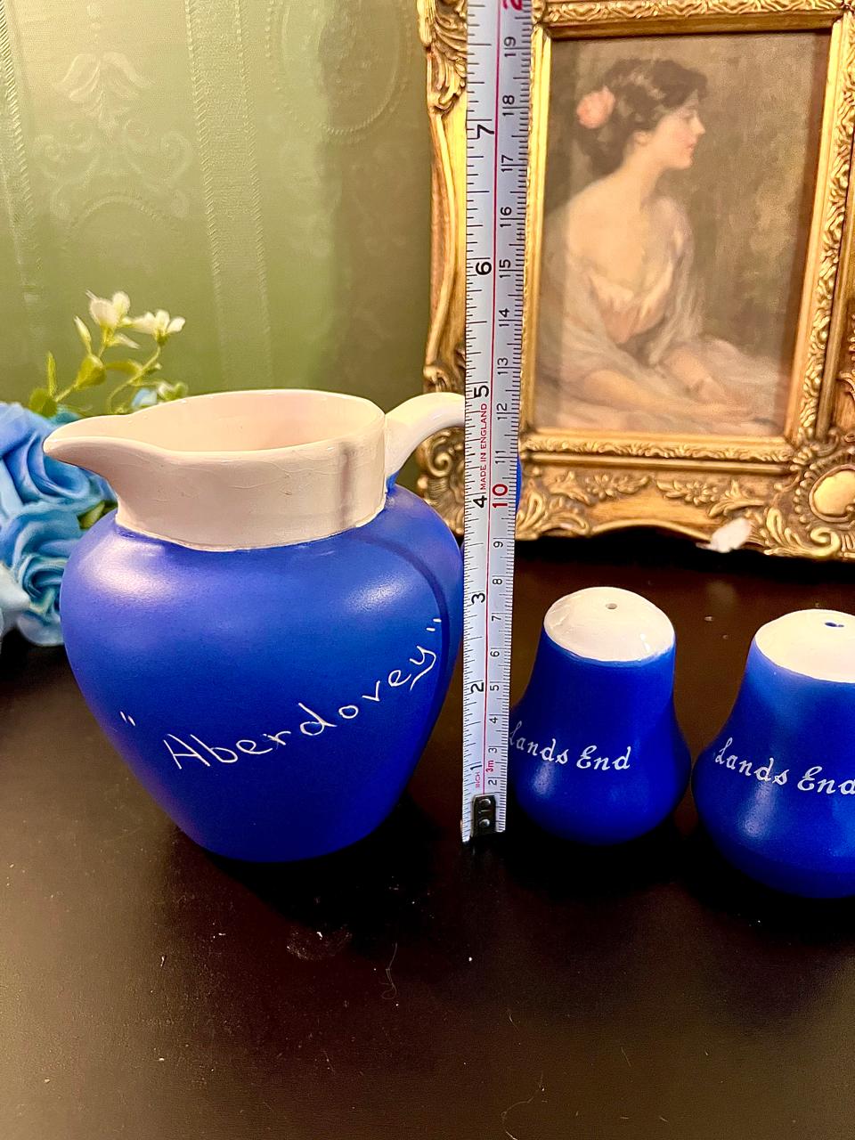 Blue jug with ruler showing approximately 6 inch height