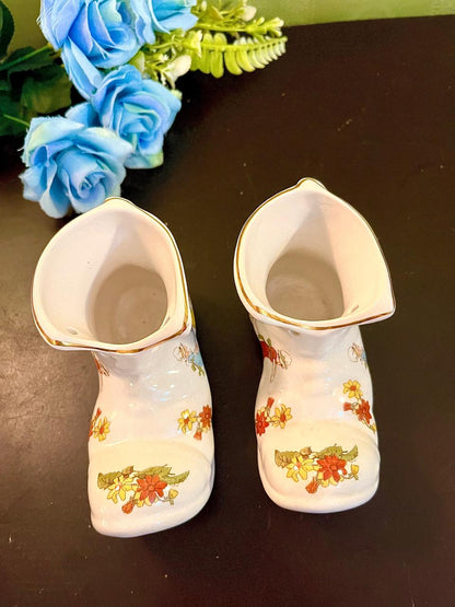 Boot vases top view showing floral gilt rim