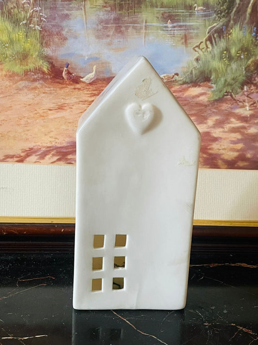 ceramic house tealight holder, white house candle holder, heart design lantern, england ceramic decor, cozy home decor pakistan, cottagecore home accessories, minimalistic candle house, ceramic night light england, rare thrift finds, vintage home accents, sunset kitchen thrift collection, ceramic tealight lamp, gift for home lovers pakistan