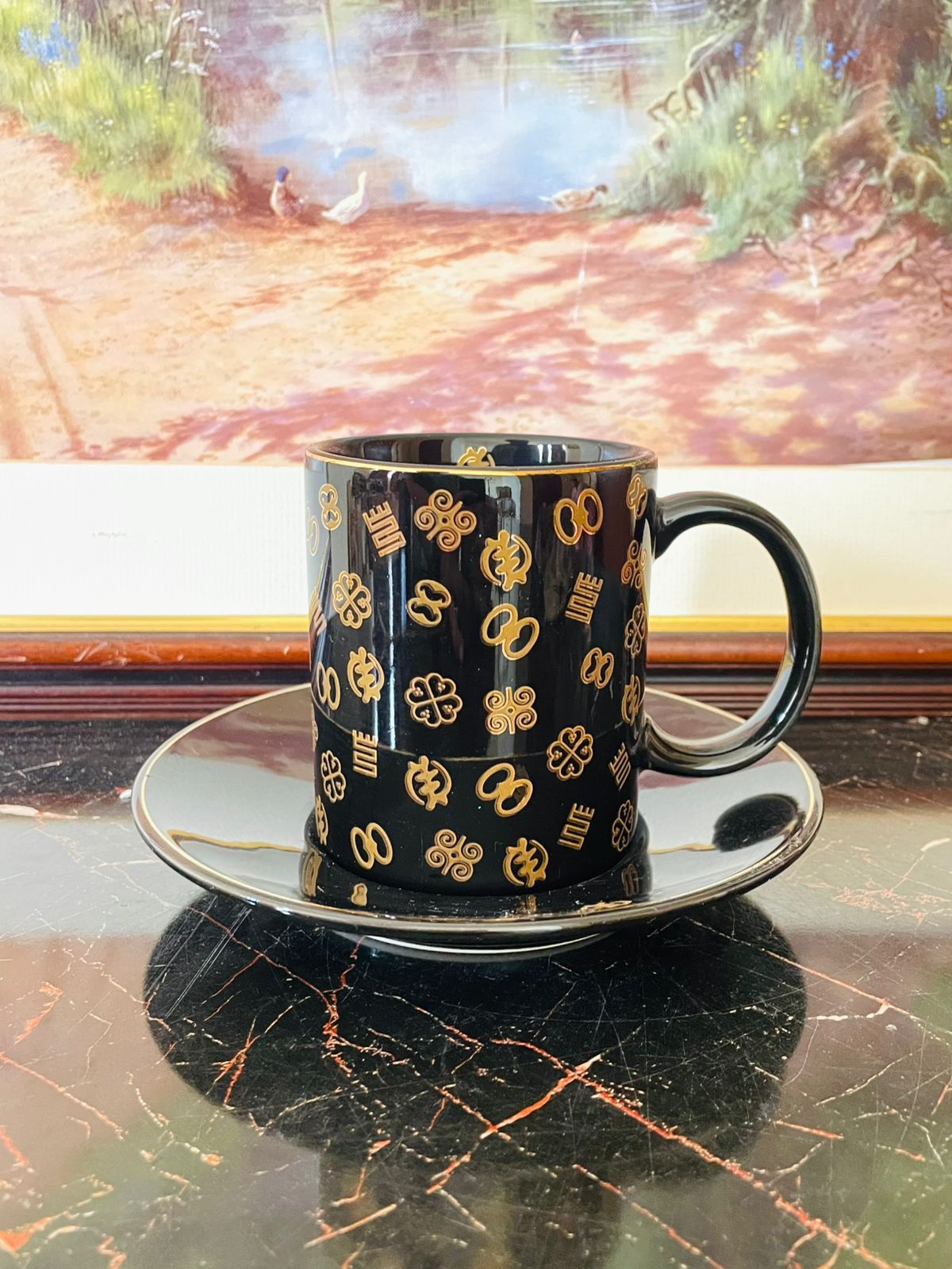 black gold porcelain cup saucer, Adinkra collection Kinaco GH, luxury tea coffee cup set, elegant black and gold crockery, vintage cup saucer set Pakistan, collectible porcelain cups, black golden tea set, rare thrift finds crockery Pakistan, heritage inspired porcelain set, Kinaco GH Adinkra tea set, unique luxury coffee cups