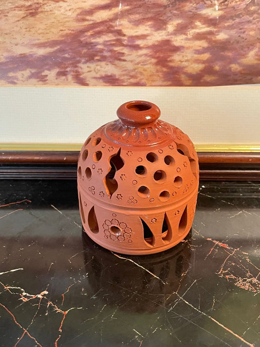 terracotta lantern Pakistan, clay candle holder vintage, handcrafted rustic décor, earthen diya lantern, eco-friendly clay lamp, terracotta tealight holder, vintage thrift décor Pakistan, rustic home accents, handmade pottery lantern, earthy sustainable décor