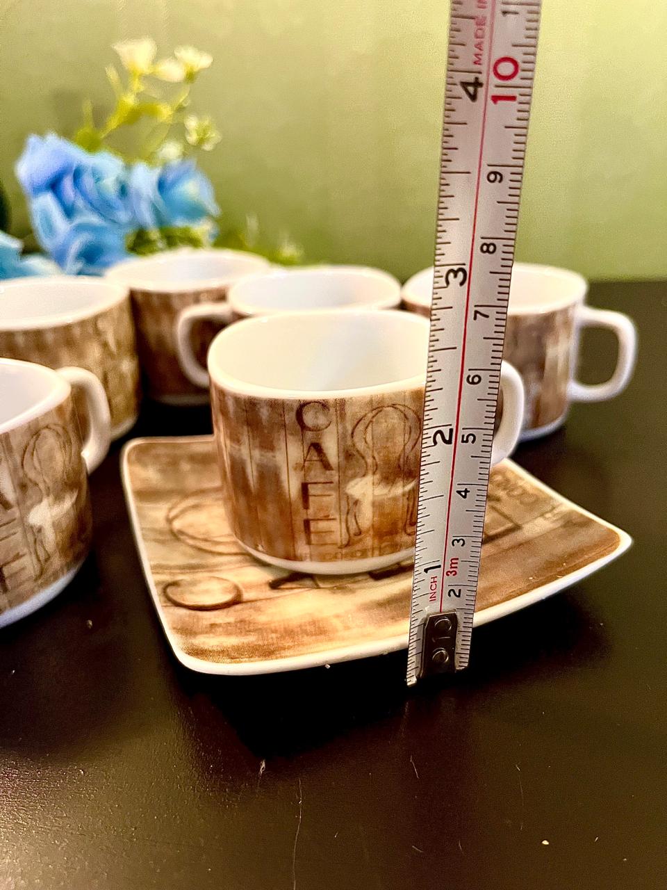 CAFE cup with ruler showing approximate 3 inch height