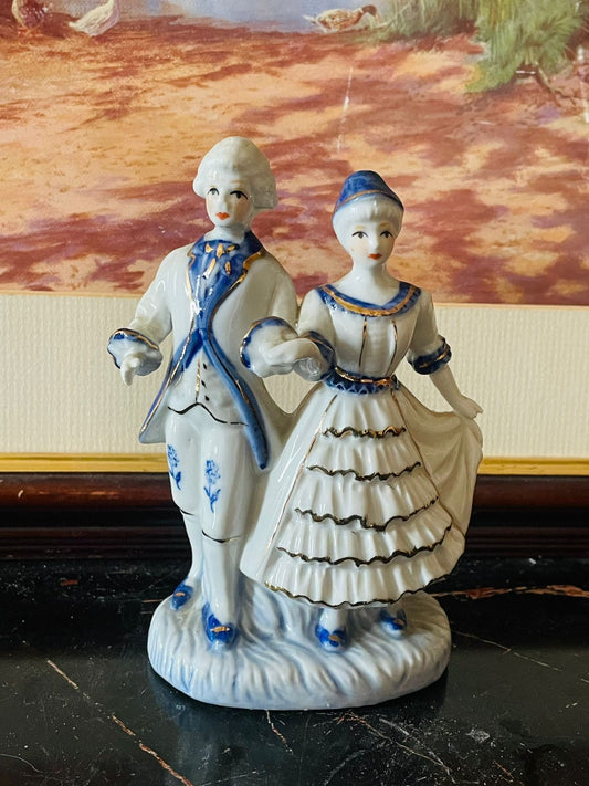 vintage porcelain couple, blue and white figurines, regency style decor, English porcelain collectibles, antique man and lady figurines, European vintage set, gold detailed porcelain, thrift home decor Pakistan, rare thrift finds, elegant vintage display, Sunset Kitchen vintage collection